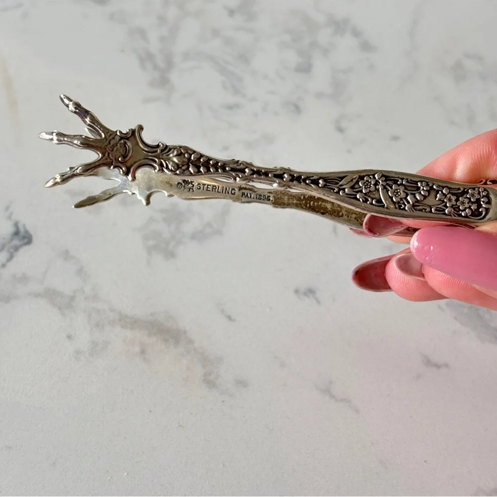 Antique sterling sugar tongs made by Whiting Manufacturing Co